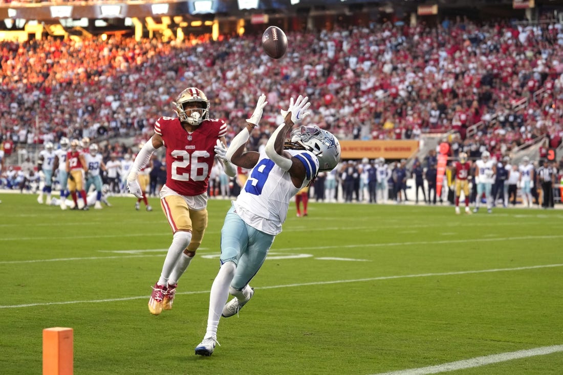 Oct 8, 2023; Santa Clara, California, USA; Dallas Cowboys wide receiver KaVontae Turpin (9) catches a touchdown pass against San Francisco 49ers cornerback Isaiah Oliver (26) during the second quarter at Levi's Stadium. Mandatory Credit: Darren Yamashita-USA TODAY Sports