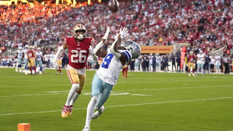 Oct 8, 2023; Santa Clara, California, USA; Dallas Cowboys wide receiver KaVontae Turpin (9) catches a touchdown pass against San Francisco 49ers cornerback Isaiah Oliver (26) during the second quarter at Levi's Stadium. Mandatory Credit: Darren Yamashita-USA TODAY Sports