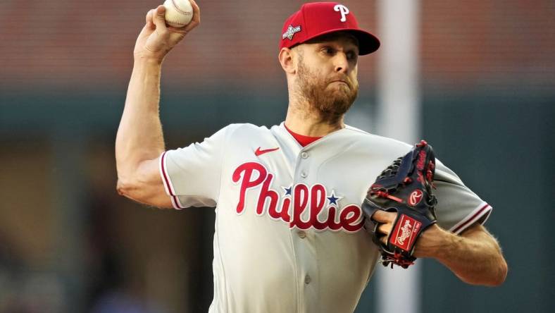 Oct 9, 2023; Cumberland, Georgia, USA; Philadelphia Phillies starting pitcher Zack Wheeler (45) pitches during the first inning against the Atlanta Braves in game two of the NLDS for the 2023 MLB playoffs at Truist Park. Mandatory Credit: Dale Zanine-USA TODAY Sports