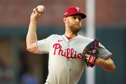 Oct 9, 2023; Cumberland, Georgia, USA; Philadelphia Phillies starting pitcher Zack Wheeler (45) pitches during the first inning against the Atlanta Braves in game two of the NLDS for the 2023 MLB playoffs at Truist Park. Mandatory Credit: Dale Zanine-USA TODAY Sports