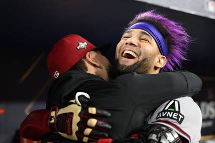 Oct 9, 2023; Los Angeles, California, USA; Arizona Diamondbacks left fielder Lourdes Gurriel Jr. (12) reacts with catcher Jose Herrera (11) after hitting a home run during the sixth inning for game two of the NLDS for the 2023 MLB playoffs at Dodger Stadium. Mandatory Credit: Jayne Kamin-Oncea-USA TODAY Sports