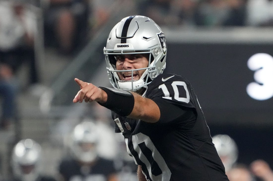 Oct 9, 2023; Paradise, Nevada, USA; Las Vegas Raiders quarterback Jimmy Garoppolo (10) throws the ball against the Green Bay Packers in the second half at Allegiant Stadium. Mandatory Credit: Kirby Lee-USA TODAY Sports