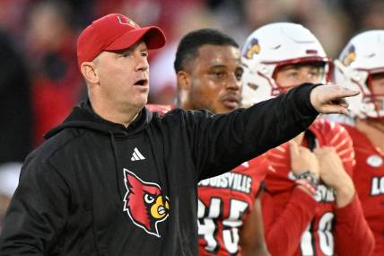 Oct 7, 2023; Louisville, Kentucky, USA;  Louisville Cardinals head coach Jeff Brohm watches his players warm up before facing off against the Notre Dame Fighting at L&N Federal Credit Union Stadium. Louisville defeated Notre Dame 33-20. Mandatory Credit: Jamie Rhodes-USA TODAY Sports