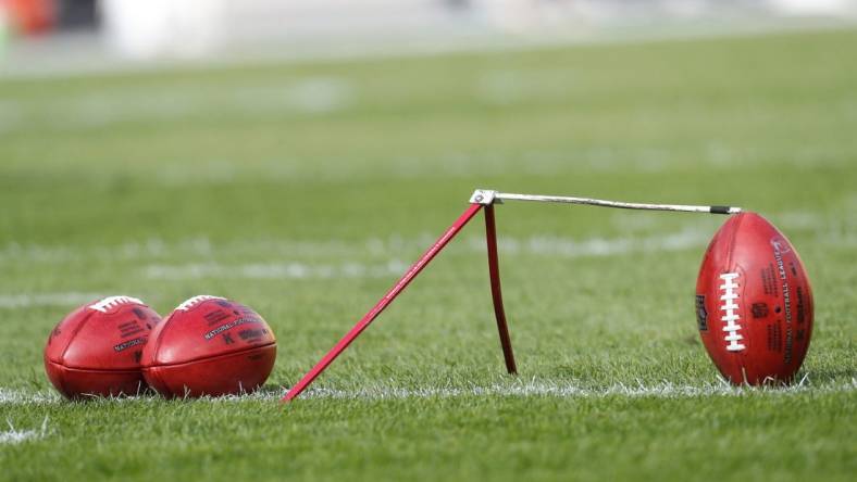 Oct 8, 2023; Pittsburgh, Pennsylvania, USA;  Official NFL game footballs and a kicking tee on the field before the Pittsburgh Steelers host the Baltimore Ravensa at Acrisure Stadium. Mandatory Credit: Charles LeClaire-USA TODAY Sports