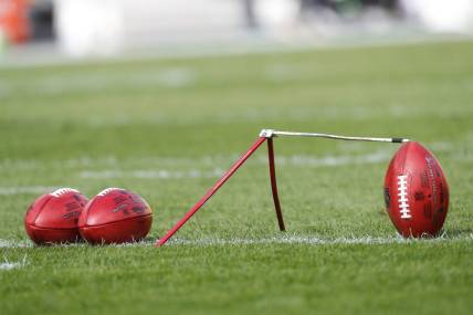 Oct 8, 2023; Pittsburgh, Pennsylvania, USA;  Official NFL game footballs and a kicking tee on the field before the Pittsburgh Steelers host the Baltimore Ravensa at Acrisure Stadium. Mandatory Credit: Charles LeClaire-USA TODAY Sports