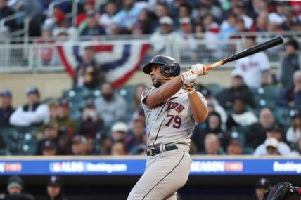 Oct 10, 2023; Minneapolis, Minnesota, USA; Houston Astros first baseman Jose Abreu (79) hits a two-run home-run in the ninth inning against the Minnesota Twins during game three of the ALDS for the 2023 MLB playoffs at Target Field. Mandatory Credit: Jesse Johnson-USA TODAY Sports