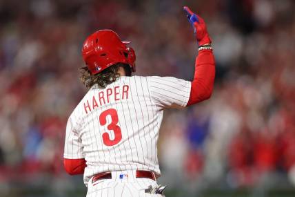 Oct 11, 2023; Philadelphia, Pennsylvania, USA; Philadelphia Phillies first baseman Bryce Harper (3) hits a solo during the fifth inning against the Atlanta Braves in game three of the NLDS for the 2023 MLB playoffs at Citizens Bank Park. Mandatory Credit: Bill Streicher-USA TODAY Sports
