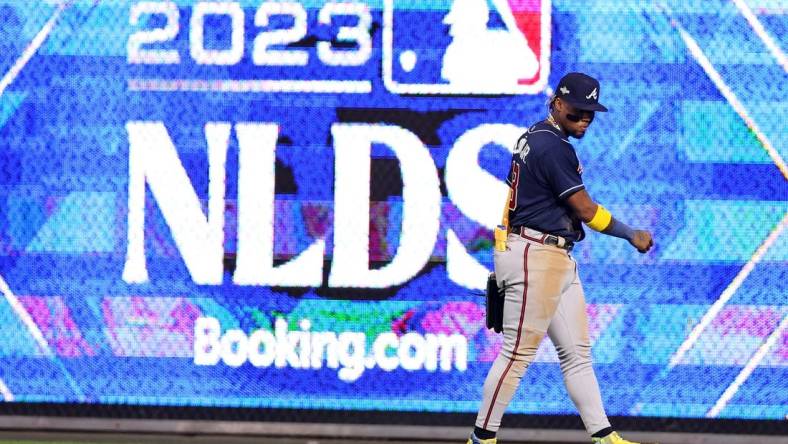 Oct 11, 2023; Philadelphia, Pennsylvania, USA;  Atlanta Braves right fielder Ronald Acuna Jr. (13) reacts during the sixth inning against the Philadelphia Phillies in game three of the NLDS for the 2023 MLB playoffs at Citizens Bank Park. Mandatory Credit: Bill Streicher-USA TODAY Sports