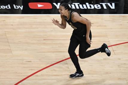 Oct 11, 2023; Las Vegas, Nevada, USA; Las Vegas Aces center Kiah Stokes (41) celebrates hitting a 3-point shot in the first half of the game against the New York Liberty during game two of the 2023 WNBA Finals at Michelob Ultra Arena. Mandatory Credit: Candice Ward-USA TODAY Sports