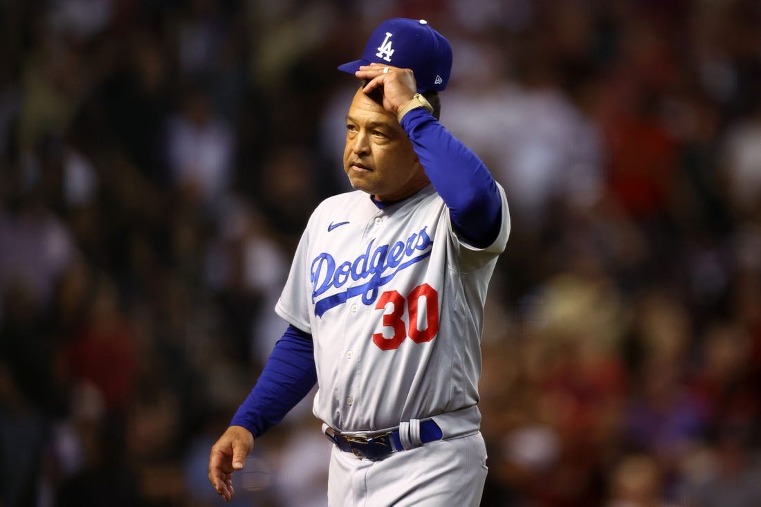 Oct 11, 2023; Phoenix, Arizona, USA; Los Angeles Dodgers manager Dave Roberts (30) reacts in the seventh inning against the Arizona Diamondbacks for game three of the NLDS for the 2023 MLB playoffs at Chase Field. Mandatory Credit: Mark J. Rebilas-USA TODAY Sports