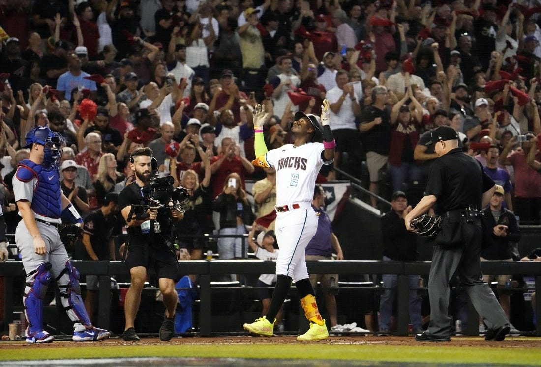 Oct 11, 2023; Phoenix, AZ, USA; Arizona Diamondbacks Geraldo Perdomo (2) reacts after hitting a home run off Los Angeles Dodgers starting pitcher Lance Lynn (35) in the third inning during Game 3 of the NLDS at Chase Field. Mandatory Credit: Rob Schumacher-Arizona Republic