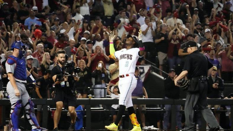 Oct 11, 2023; Phoenix, AZ, USA; Arizona Diamondbacks Geraldo Perdomo (2) reacts after hitting a home run off Los Angeles Dodgers starting pitcher Lance Lynn (35) in the third inning during Game 3 of the NLDS at Chase Field. Mandatory Credit: Rob Schumacher-Arizona Republic