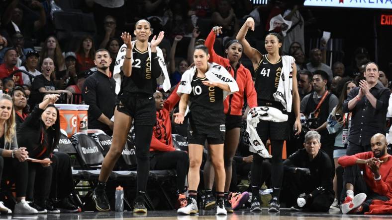 Oct 11, 2023; Las Vegas, Nevada, USA; Las Vegas Aces forward A'ja Wilson (22), guard Kelsey Plum (10), guard Jackie Young (0) and center Kiah Stokes (41) react to a play against the New York Liberty during the second half during game two of the 2023 WNBA Finals at Michelob Ultra Arena. Mandatory Credit: Candice Ward-USA TODAY Sports