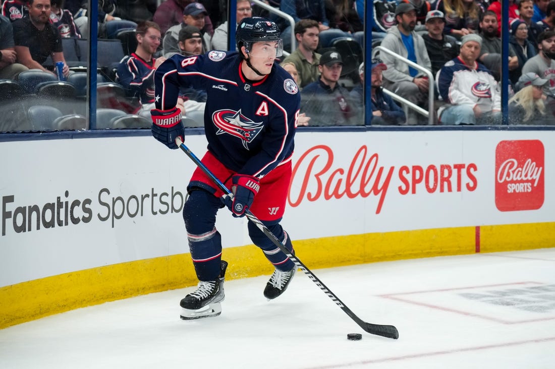 Oct 12, 2023; Columbus, Ohio, USA;  Columbus Blue Jackets defenseman Zach Werenski (8) skates with the puck against the Philadelphia Flyers in the second period at Nationwide Arena. Mandatory Credit: Aaron Doster-USA TODAY Sports