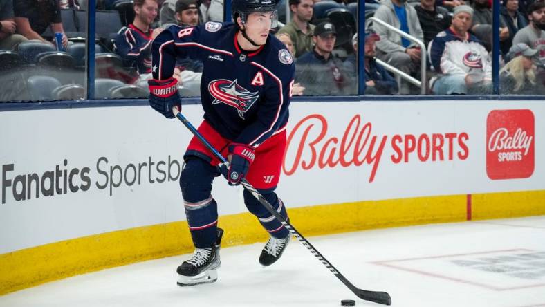 Oct 12, 2023; Columbus, Ohio, USA;  Columbus Blue Jackets defenseman Zach Werenski (8) skates with the puck against the Philadelphia Flyers in the second period at Nationwide Arena. Mandatory Credit: Aaron Doster-USA TODAY Sports