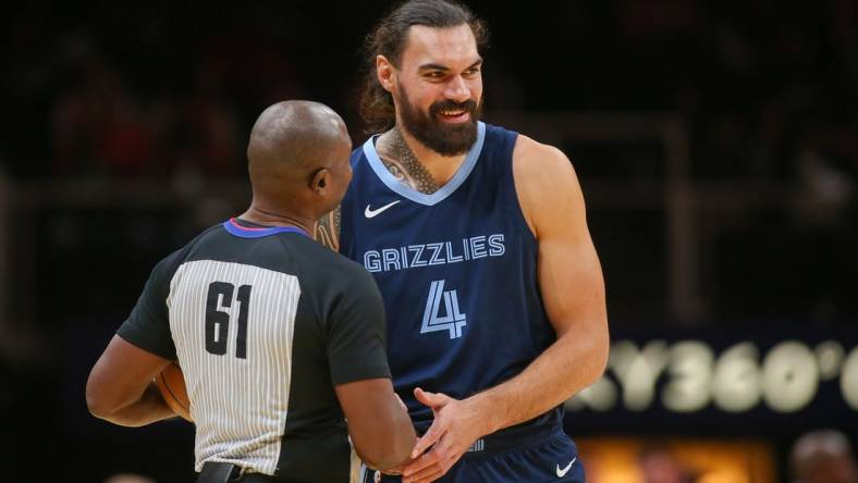 Oct 12, 2023; Atlanta, Georgia, USA; Memphis Grizzlies center Steven Adams (4) talks to referee Courtney Kirkland (61) before a game against the Atlanta Hawks in the first half at State Farm Arena. Mandatory Credit: Brett Davis-USA TODAY Sports