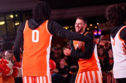 Tennessee's Santiago Vescovi (35) laughs with Jonas Aidoo (0) during the Market Square Madness preseason fan event for Tennessee men's and women's basketball held in downtown Knoxville's Market Square on Thursday, Oct. 12, 2023.