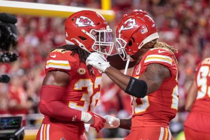 Oct 12, 2023; Kansas City, Missouri, USA; Kansas City Chiefs linebacker Nick Bolton (32) and Kansas City Chiefs safety Justin Reid (20) celebrate after a play during the third quarter against the Denver Broncos  at GEHA Field at Arrowhead Stadium. Mandatory Credit: William Purnell-USA TODAY Sports