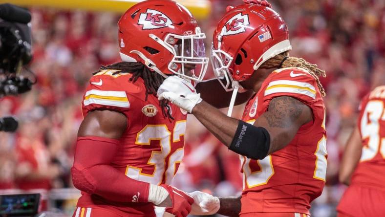 Oct 12, 2023; Kansas City, Missouri, USA; Kansas City Chiefs linebacker Nick Bolton (32) and Kansas City Chiefs safety Justin Reid (20) celebrate after a play during the third quarter against the Denver Broncos  at GEHA Field at Arrowhead Stadium. Mandatory Credit: William Purnell-USA TODAY Sports