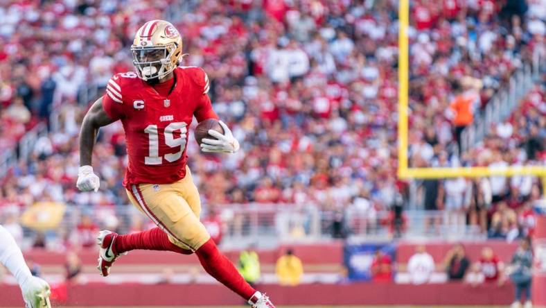 October 8, 2023; Santa Clara, California, USA; San Francisco 49ers wide receiver Deebo Samuel (19) runs the football during the first quarter against the Dallas Cowboys at Levi's Stadium. Mandatory Credit: Kyle Terada-USA TODAY Sports