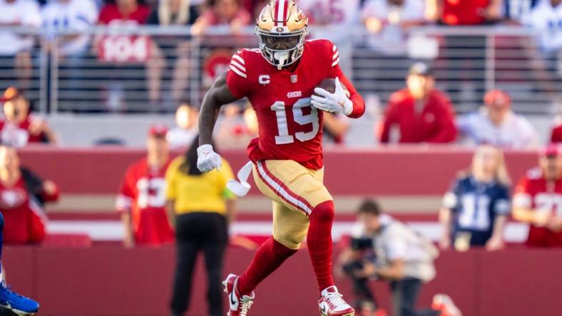 October 8, 2023; Santa Clara, California, USA; San Francisco 49ers wide receiver Deebo Samuel (19) runs the football against the Dallas Cowboys during the first quarter at Levi's Stadium. Mandatory Credit: Kyle Terada-USA TODAY Sports