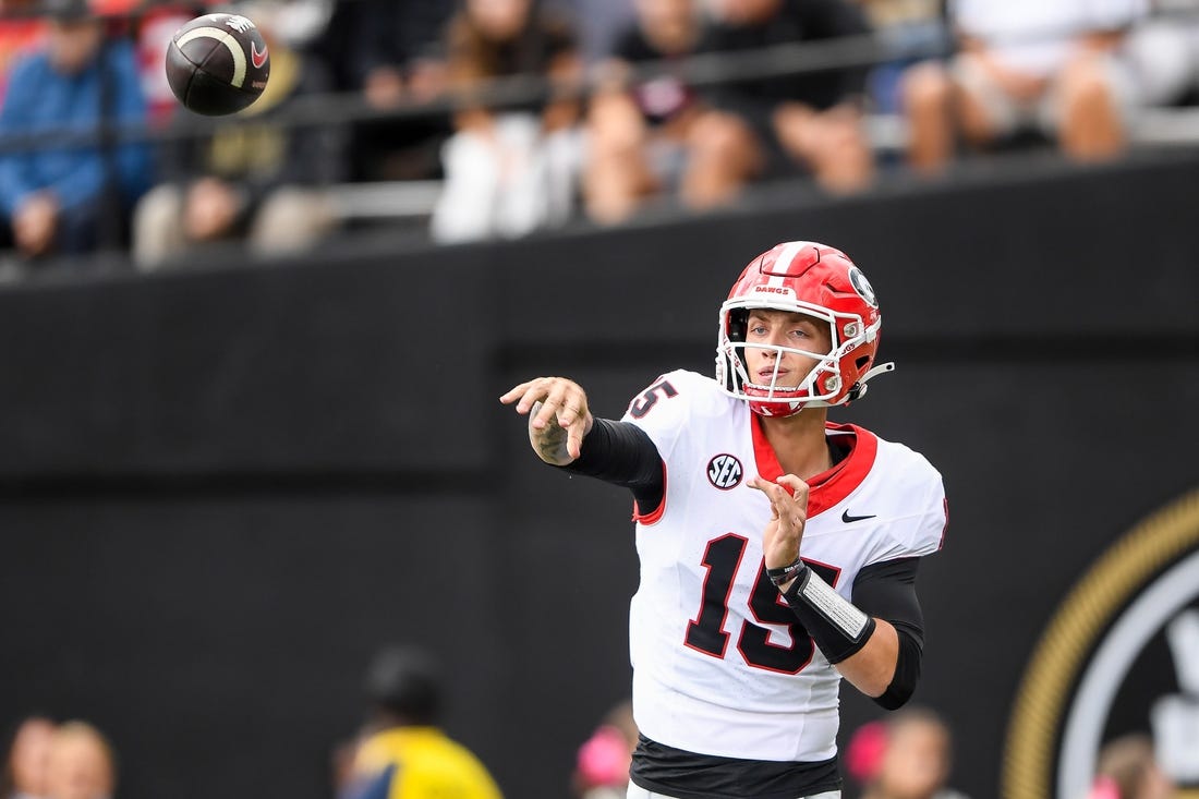 Oct 14, 2023; Nashville, Tennessee, USA;  Georgia Bulldogs quarterback Carson Beck (15) throws a pass against the Vanderbilt Commodores during the second half at FirstBank Stadium. Mandatory Credit: Steve Roberts-USA TODAY Sports