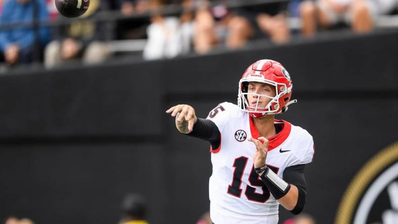 Oct 14, 2023; Nashville, Tennessee, USA;  Georgia Bulldogs quarterback Carson Beck (15) throws a pass against the Vanderbilt Commodores during the second half at FirstBank Stadium. Mandatory Credit: Steve Roberts-USA TODAY Sports