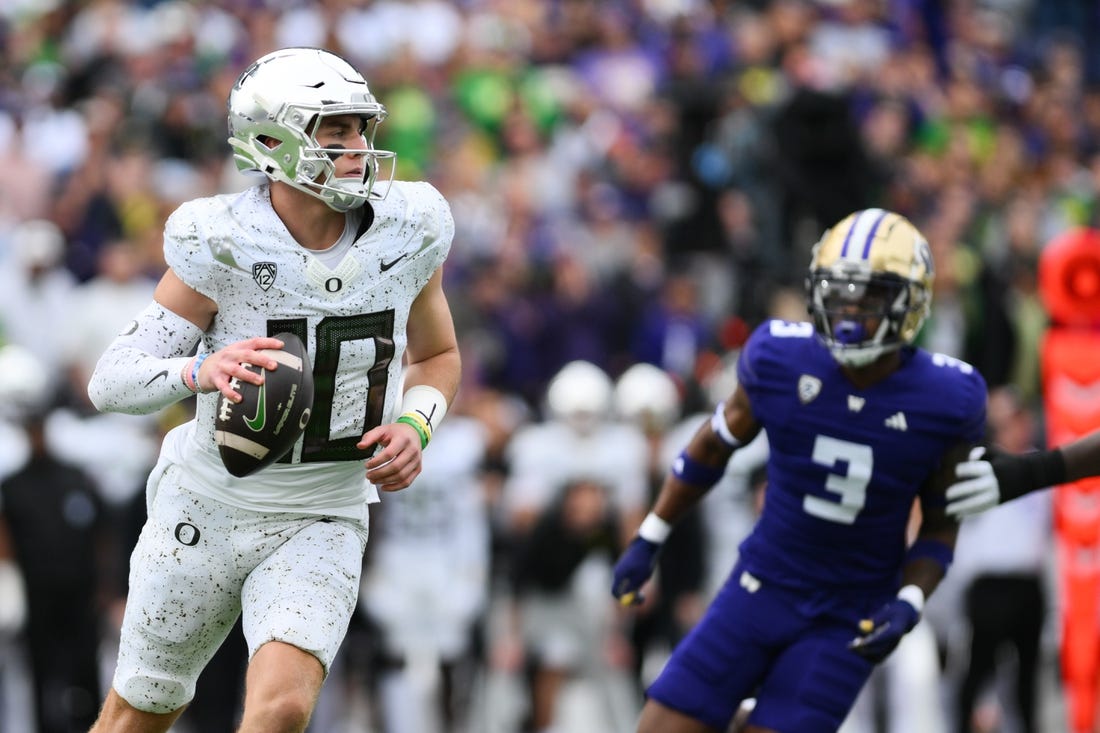 Oct 14, 2023; Seattle, Washington, USA; Oregon Ducks quarterback Bo Nix (10) looks to pass the ball during the first half against the Washington Huskies at Alaska Airlines Field at Husky Stadium. Mandatory Credit: Steven Bisig-USA TODAY Sports