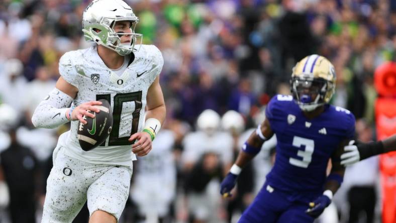 Oct 14, 2023; Seattle, Washington, USA; Oregon Ducks quarterback Bo Nix (10) looks to pass the ball during the first half against the Washington Huskies at Alaska Airlines Field at Husky Stadium. Mandatory Credit: Steven Bisig-USA TODAY Sports