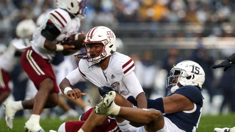 Oct 14, 2023; University Park, Pennsylvania, USA; Penn State Nittany Lions defensive end Amin Vanover (15) tackles Massachusetts Minutemen quarterback Taisun Phommachanh (3) in the back field during the first quarter at Beaver Stadium. Mandatory Credit: Matthew O'Haren-USA TODAY Sports