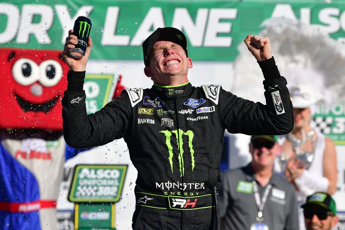 Oct 14, 2023; Las Vegas, Nevada, USA; NASCAR Xfinity Series driver Riley Herbst (98) celebrates his victory of the Alsco Uniforms 302 at Las Vegas Motor Speedway. Mandatory Credit: Gary A. Vasquez-USA TODAY Sports