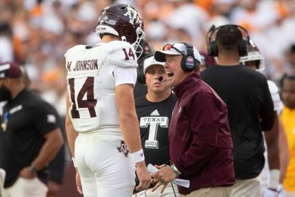 Oct 14, 2023; Knoxville, TN, USA; Texas A&M quarterback Max Johnson (14) talks with Texas A&M head coach Jimbo Fisher during a football game between Tennessee and Texas A&M at Neyland Stadium in Knoxville, Tenn., on Saturday, Oct. 14, 2023. Mandatory Credit: Brianna Paciorka-USA TODAY Sports