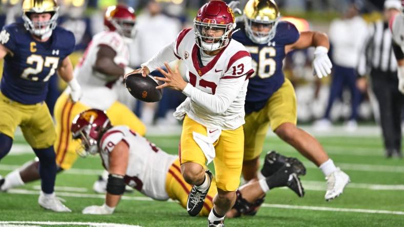 Oct 14, 2023; South Bend, Indiana, USA; USC Trojans quarterback Caleb Williams (13) runs the ball in the second quarter against the Notre Dame Fighting Irish at Notre Dame Stadium. Mandatory Credit: Matt Cashore-USA TODAY Sports