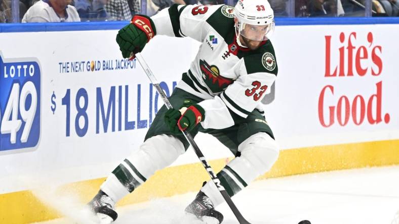 Oct 14, 2023; Toronto, Ontario, CAN;   Minnesota Wild defenseman Alex Goligoski (33) turns with the puck against the Toronto Maple Leafs in the first period at Scotiabank Arena. Mandatory Credit: Dan Hamilton-USA TODAY Sports