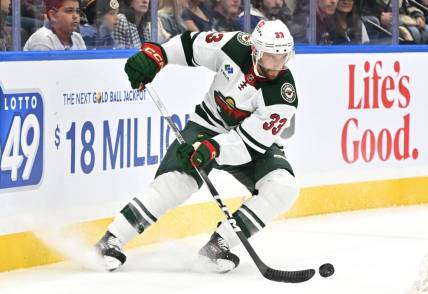 Oct 14, 2023; Toronto, Ontario, CAN;   Minnesota Wild defenseman Alex Goligoski (33) turns with the puck against the Toronto Maple Leafs in the first period at Scotiabank Arena. Mandatory Credit: Dan Hamilton-USA TODAY Sports