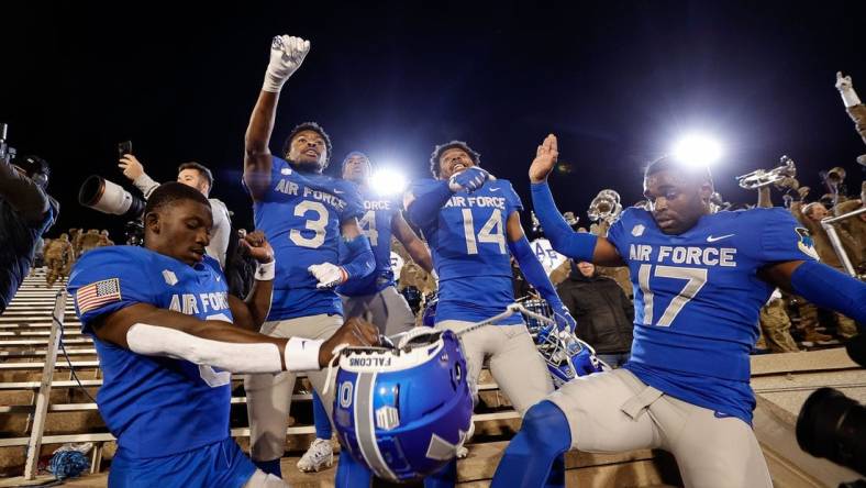 Oct 14, 2023; Colorado Springs, Colorado, USA; Air Force Falcons defensive back Trey Williams (0) and defensive back Jamari Bellamy (3) and fullback Emmanuel Michel (4) and defensive back K.C. Beard (14) and cornerback Zion Kelly (17) celebrate after the game against the Wyoming Cowboys at Falcon Stadium. Mandatory Credit: Isaiah J. Downing-USA TODAY Sports