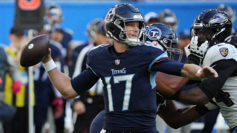 Oct 15, 2023; London, United Kingdom; Tennessee Titans quarterback Ryan Tannehill (17) throws the ball against the Baltimore Ravens in the first half during an NFL International Series game at Tottenham Hotspur Stadium. Mandatory Credit: Kirby Lee-USA TODAY Sports