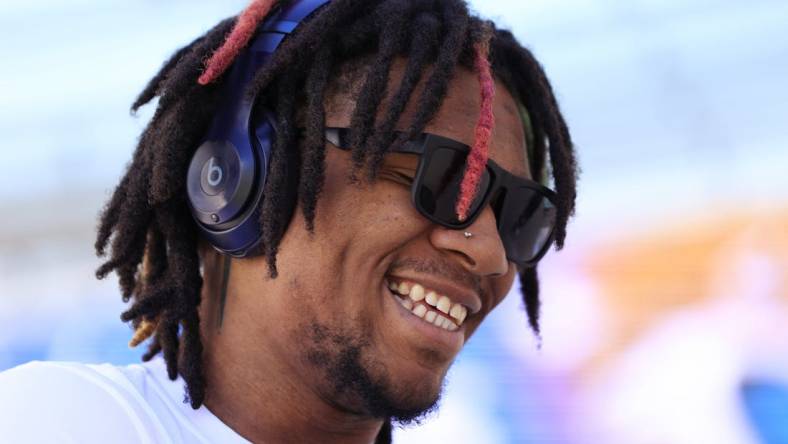 Indianapolis Colts quarterback Anthony Richardson (5) smiles while signing autographs before an NFL football matchup against the Jacksonville Jaguars Sunday, Oct. 15, 2023 at EverBank Stadium in Jacksonville, Fla. Richardson is on injured reserve after suffering a shoulder injury in week 5 against the Tennessee Titans. [Corey Perrine/Florida Times-Union]