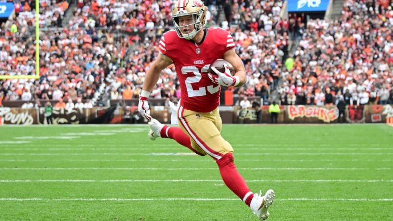 Oct 15, 2023; Cleveland, Ohio, USA; San Francisco 49ers running back Christian McCaffrey (23) scores a touchdown during the first half against the Cleveland Browns at Cleveland Browns Stadium. Mandatory Credit: Ken Blaze-USA TODAY Sports