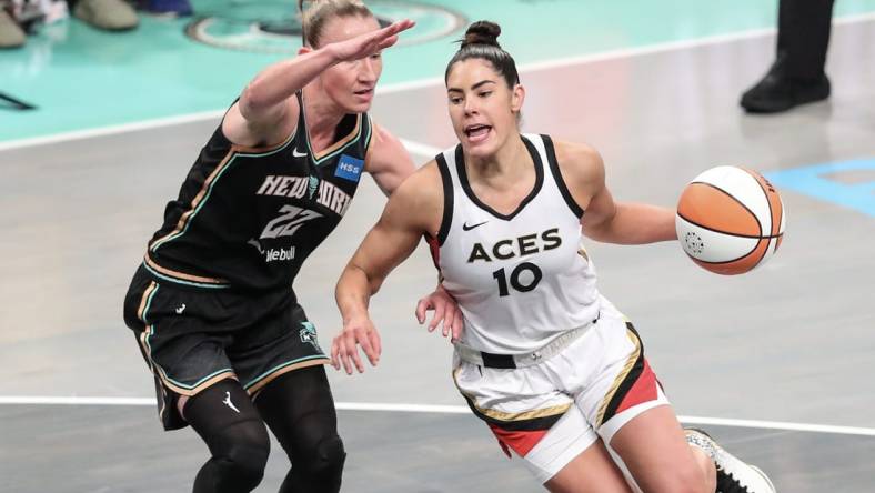 Oct 15, 2023; Brooklyn, New York, USA; Las Vegas Aces guard Kelsey Plum (10) drives around New York Liberty guard Courtney Vandersloot (22) in the first quarter during game three of the 2023 WNBA Finals at Barclays Center. Mandatory Credit: Wendell Cruz-USA TODAY Sports