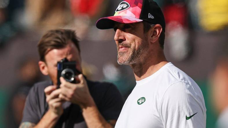 Oct 15, 2023; East Rutherford, New Jersey, USA; New York Jets quarterback Aaron Rodgers (8) on the field before the game against the Philadelphia Eagles at MetLife Stadium. Mandatory Credit: Vincent Carchietta-USA TODAY Sports