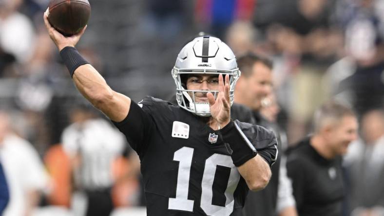 Oct 15, 2023; Paradise, Nevada, USA; Las Vegas Raiders quarterback Jimmy Garoppolo (10) warms up against the New England Patriots at Allegiant Stadium. Mandatory Credit: Candice Ward-USA TODAY Sports