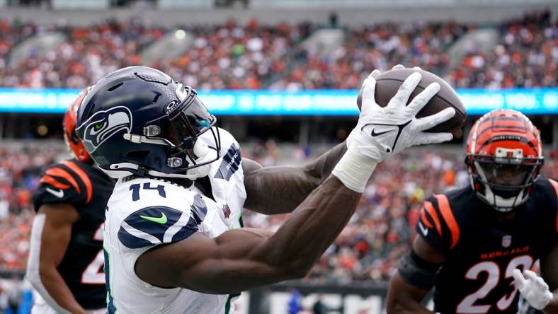 Oct 15, 2023; Cincinnati, Ohio, USA;  Seattle Seahawks wide receiver DK Metcalf (14) catches a pass but is out of bounds near the end zone in the third quarter against the Cincinnati Bengals at Paycor Stadium. Mandatory Credit: Kareem Elgazzar-USA TODAY Sports