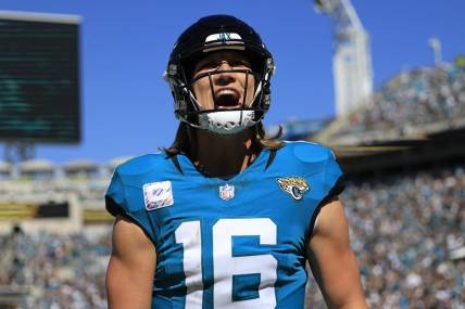 Jacksonville Jaguars quarterback Trevor Lawrence (16) yells after wide receiver Christian Kirk (13), not shown, caught a pass for a touchdown score during the second quarter of an NFL football matchup Sunday, Oct. 15, 2023 at EverBank Stadium in Jacksonville, Fla. The Jacksonville Jaguars defeated the Indianapolis Colts 37-20. [Corey Perrine/Florida Times-Union]