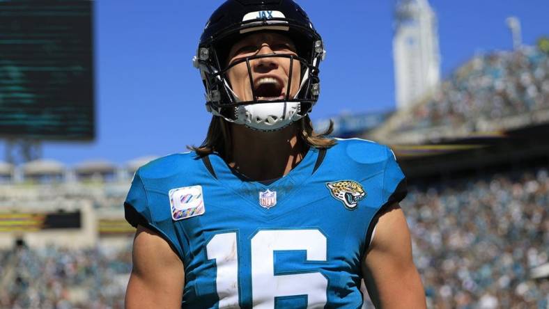 Jacksonville Jaguars quarterback Trevor Lawrence (16) yells after wide receiver Christian Kirk (13), not shown, caught a pass for a touchdown score during the second quarter of an NFL football matchup Sunday, Oct. 15, 2023 at EverBank Stadium in Jacksonville, Fla. The Jacksonville Jaguars defeated the Indianapolis Colts 37-20. [Corey Perrine/Florida Times-Union]