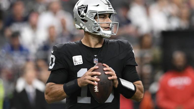 Oct 15, 2023; Paradise, Nevada, USA; Las Vegas Raiders quarterback Jimmy Garoppolo (10) looks to make a pass against the New England Patriots in the first quarter at Allegiant Stadium. Mandatory Credit: Candice Ward-USA TODAY Sports