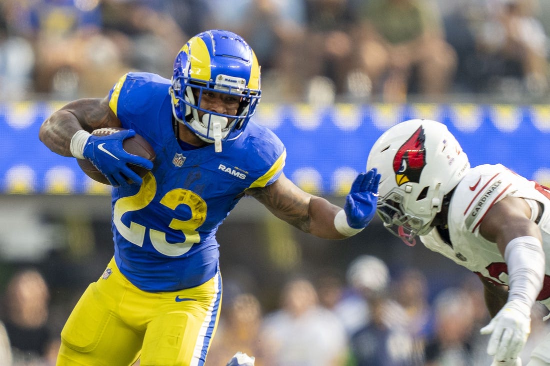 October 15, 2023; Inglewood, California, USA; Los Angeles Rams running back Kyren Williams (23) runs the football against Arizona Cardinals cornerback Marco Wilson (20) during the third quarter at SoFi Stadium. Mandatory Credit: Kyle Terada-USA TODAY Sports