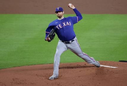 Oct 15, 2023; Houston, Texas, USA; Texas Rangers pitcher Jordan Montgomery (52) throws during the first inning of game one of the ALCS against the Houston Astros in the 2023 MLB playoffs at Minute Maid Park. Mandatory Credit: Erik Williams-USA TODAY Sports