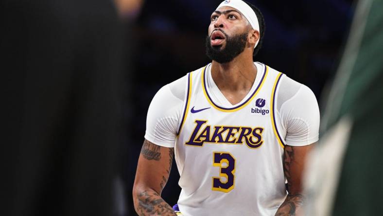 Oct 15, 2023; Los Angeles, California, USA; Los Angeles Lakers forward Anthony Davis (3) shoots a free-throw against the Milwaukee Bucks in the second quarter at Crypto.com Arena. Mandatory Credit: Jonathan Hui-USA TODAY Sports