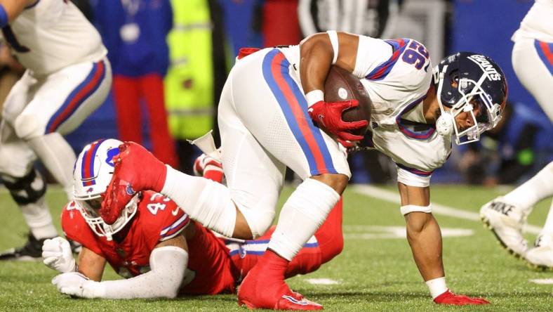 New York Giants running back Saquon Barkley (26) regains his balance on this run against the Bills.